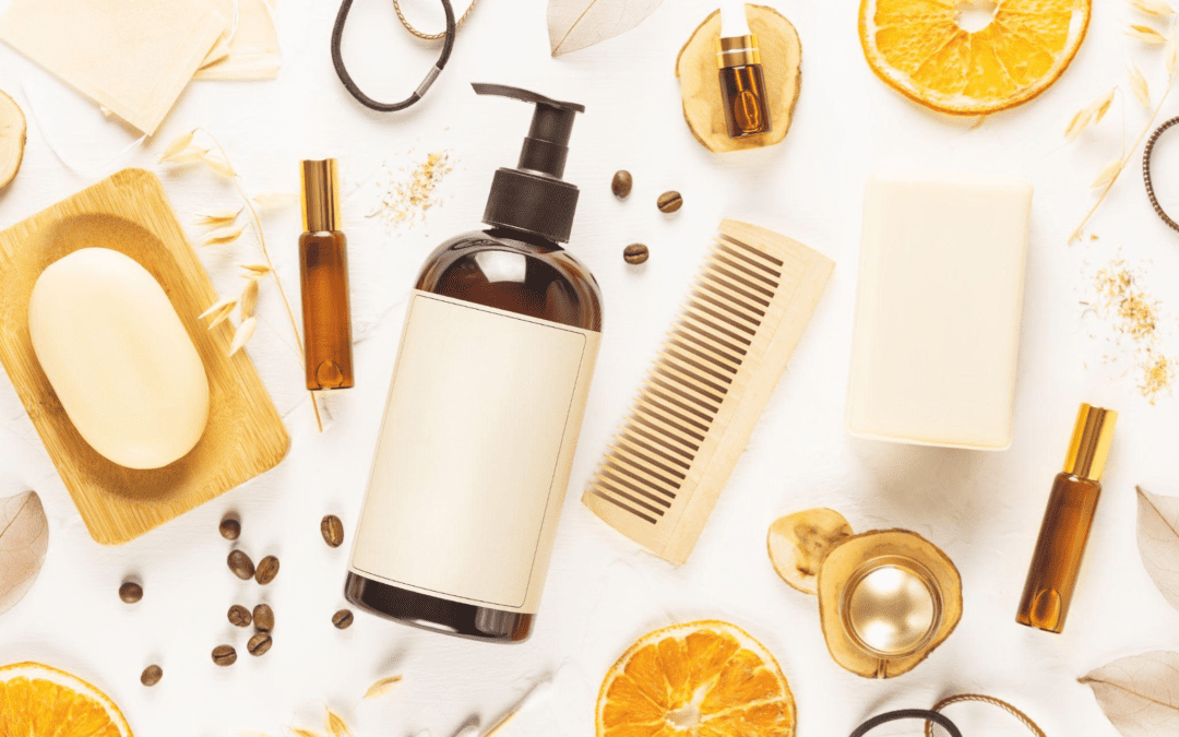 Hair care products like shampoo bottle, combs, organic soap, oil, lemon and coffee beans on white background with hair accessories.