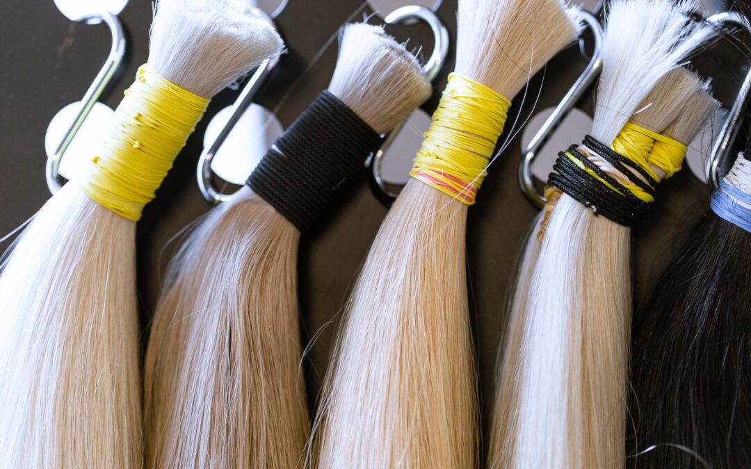 Samples of hair extensions on a display board.